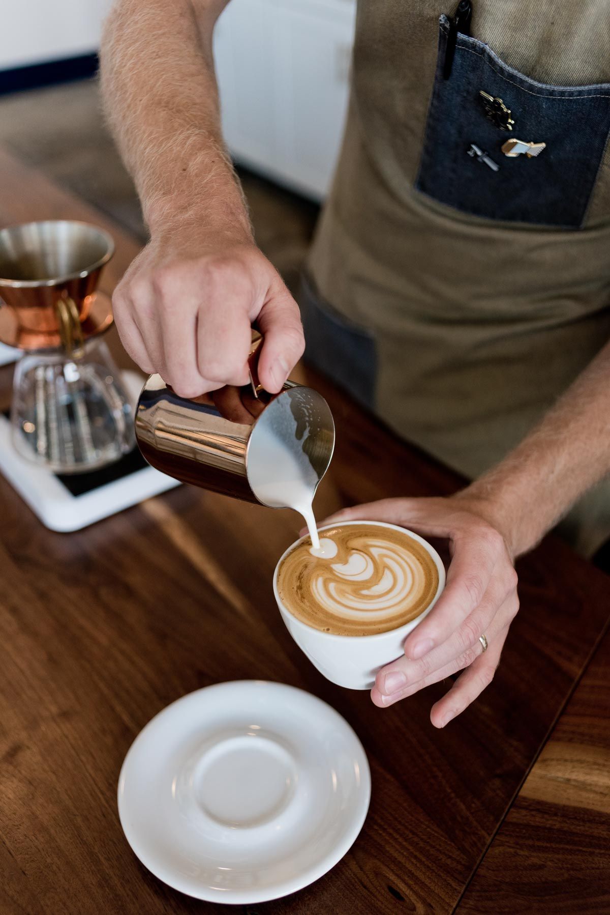 Coffee being finished with milk